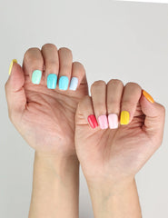 Side angle of hand showing Fruit Punch handmade Singapore press on nails with colorful, playful design