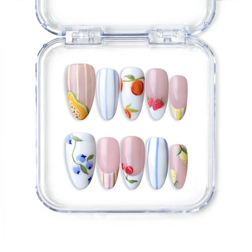 Handmade pink almond press on nails with floral art and fruit motifs, from Singapore brand Naillover