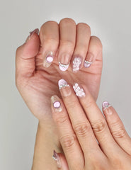 Close-up of Naillover Gemstone Latte Singapore press on nails featuring iridescent tones, seashell motifs, and whimsical 3D pearl embellishments.