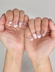 Naillover Gemstone Latte trendy nails styled on hand, showcasing handmade ocean-inspired press on nails with a mermaid theme.