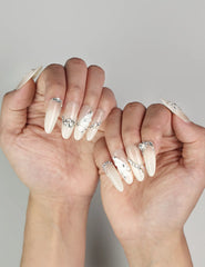 Elegant Glimmer Mirage translucent handmade Singapore press-on nails with silver glitter and butterfly designs by naillover