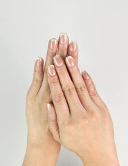 Hand wearing Glossy Pink Singapore press on nails in bronze-pink with gold foil accents, handmade by naillover