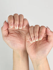 Side view of Glossy Pink handmade Singapore press on nails featuring elegant bronze-pink and gold foil design