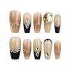 Gold Tips Singapore press on nails on white background, featuring nude base, gold accents, pearls, and stones – handmade by naillover