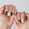 Hands fanned out to highlight handmade short square nails with a luxe gold gloss and soft caramel veining by Naillover
