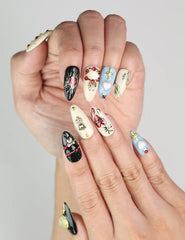 Elegant hand pose showing Gothic Blossoms handmade Singapore press on nails with glittering rhinestone and metallic rose details by naillover