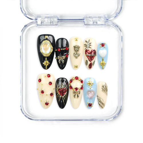 Close-up of Gothic Blossoms handmade Singapore press on nails with metallic roses, heart motifs, and rhinestone accents on black and silver base, by naillover