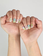 Hand pose showing Gradient Heart handmade press on nails in soft pastel colors, stylish Singapore press on nails