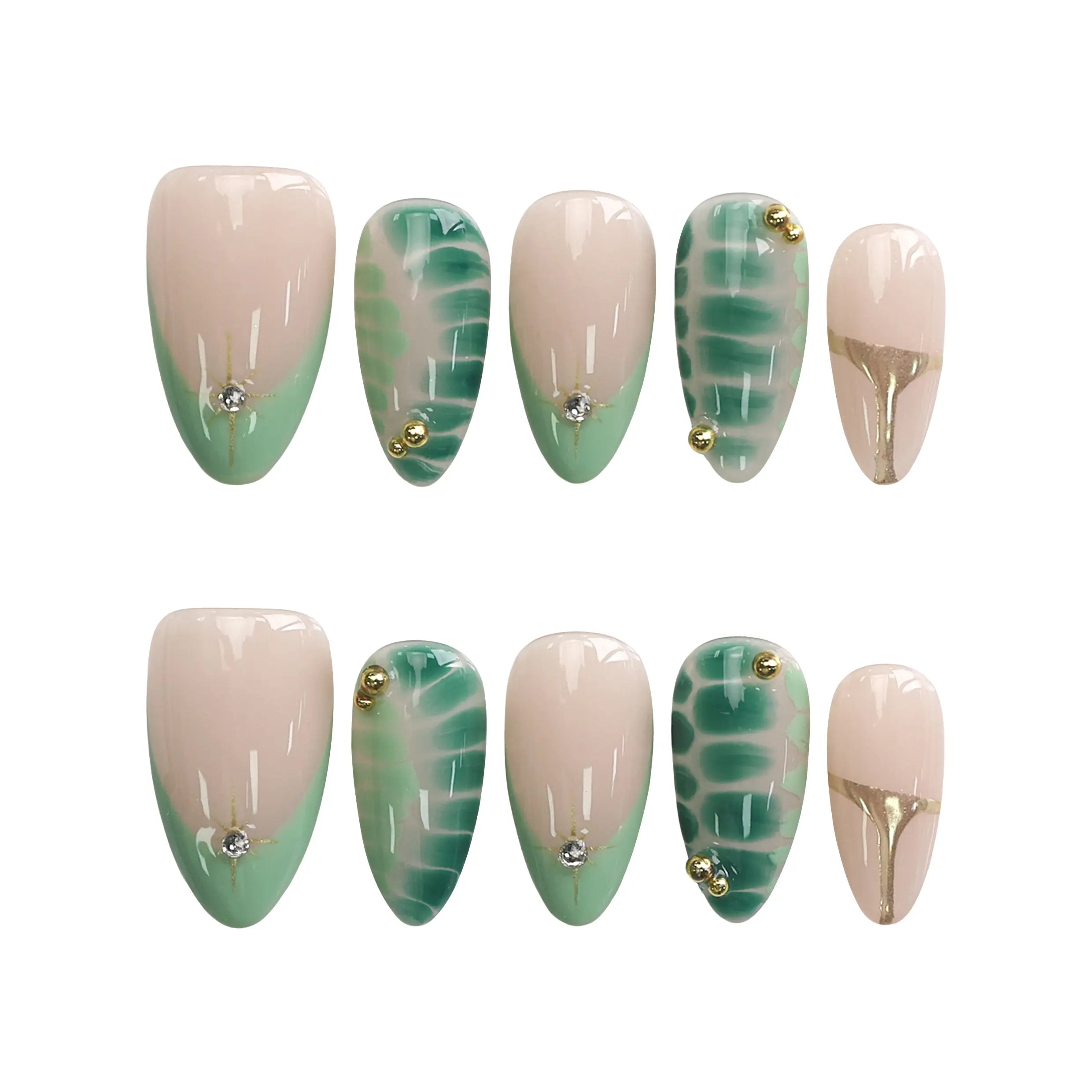 Product display of short almond press-on nails in nude and green shades with tropical leaf patterns and golden touches