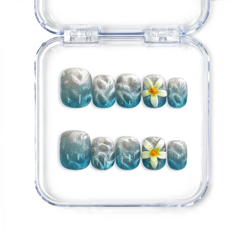 Handmade Singapore blue press on nails by Naillover featuring ombré blend and white floral nail art in a short squoval shape