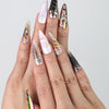 Hand gesture featuring Singapore handmade stiletto press on nails with multicolor chrome finish and embedded gem accents by Naillover