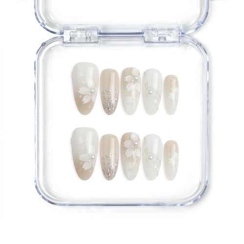 Naillover handmade Singapore press on nails in medium oval shape featuring ivory tones, 3D flower nail art, and pearl accents