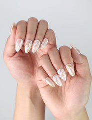 Fingers posed to highlight Naillover’s Singapore handmade nails featuring pastel pink tones and delicate 3D floral embellishments