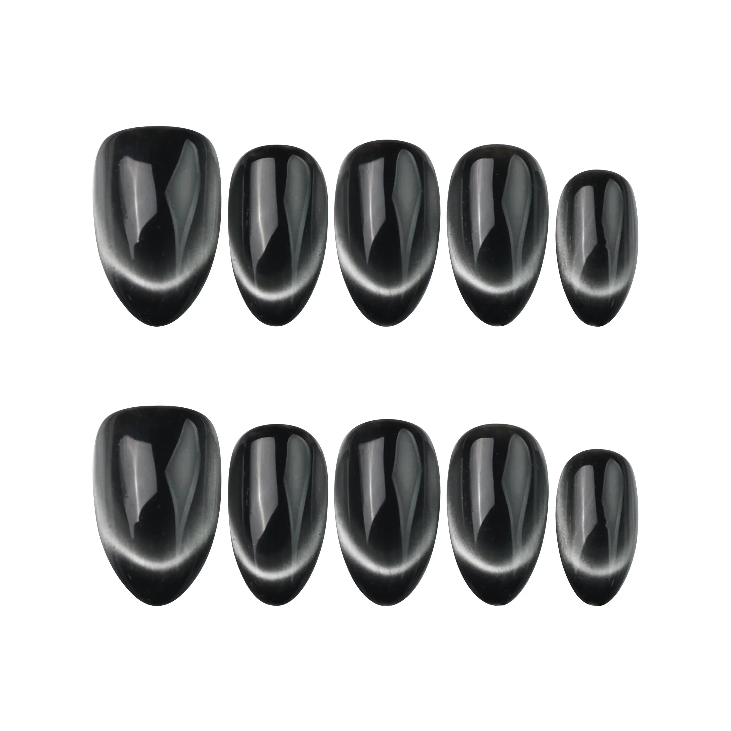 Midnight Gaze black almond handmade press on nails laid on white background, glowing with cat eye detail.