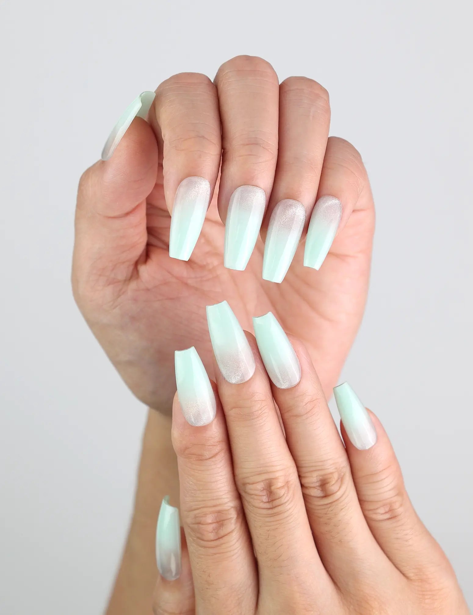 Model styling Misty Blue Fade long coffin press on nails by Naillover, ideal for a minimalist winter look.