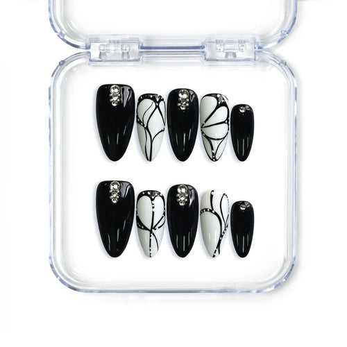 Singapore handmade almond press on nails by Naillover featuring black and white butterfly patterns and beaded details