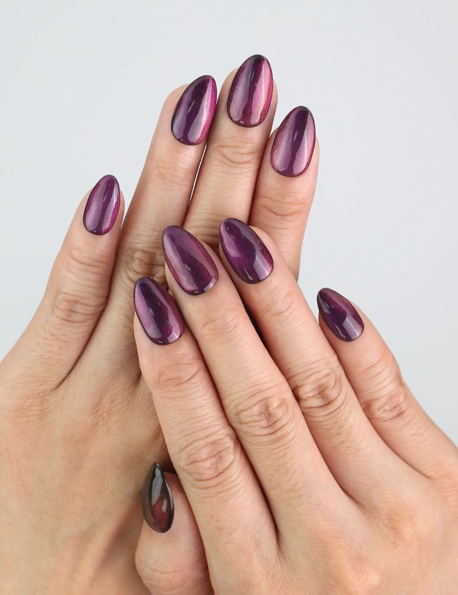 Wearing Amethyst cat eye press on nails in short almond shape by Naillover.