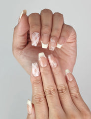 Close-up of Naillover Ballet Bow coquette press on nails featuring delicate bows and pearl accents.