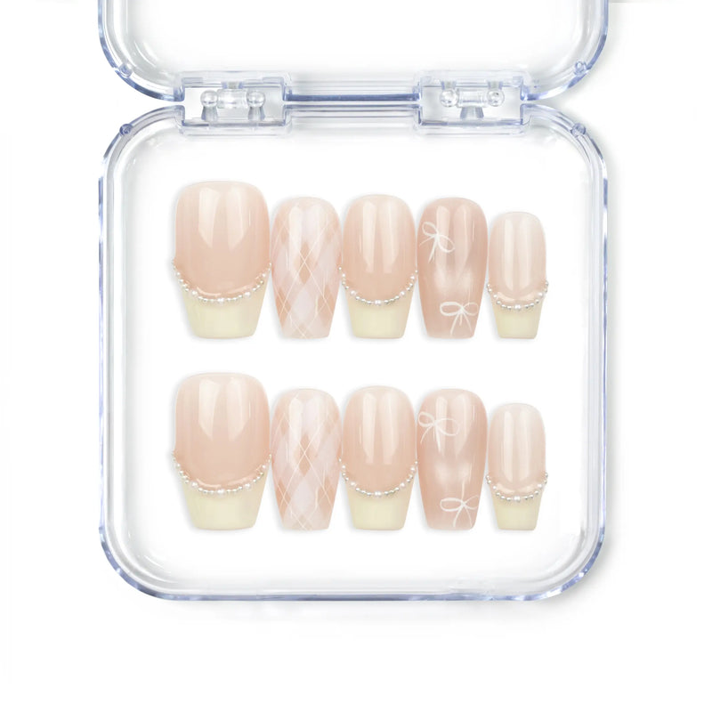 Naillover Ballet Bow handmade Singapore press on nails in soft pink and yellow with bow and pearl accents.