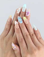 Model wearing Naillover Bloom Harmony press on nails — pastel pink and lavender nails with 3D floral accents, handmade in Singapore.