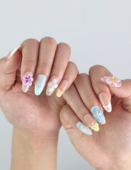 Styled hand pose featuring Naillover handmade press on nails — Bloom Harmony in soft hues, ideal for spring fashion and Singapore nail lovers.