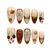 Naillover Blossom Latte Singapore press on nails set displayed on white background, featuring handmade beige base with floral and gold accents