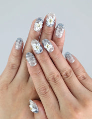 Model hand showcasing Naillover Blue Blossom nails—3D summer nails with soft ocean blue and floral accents, handmade in Singapore.