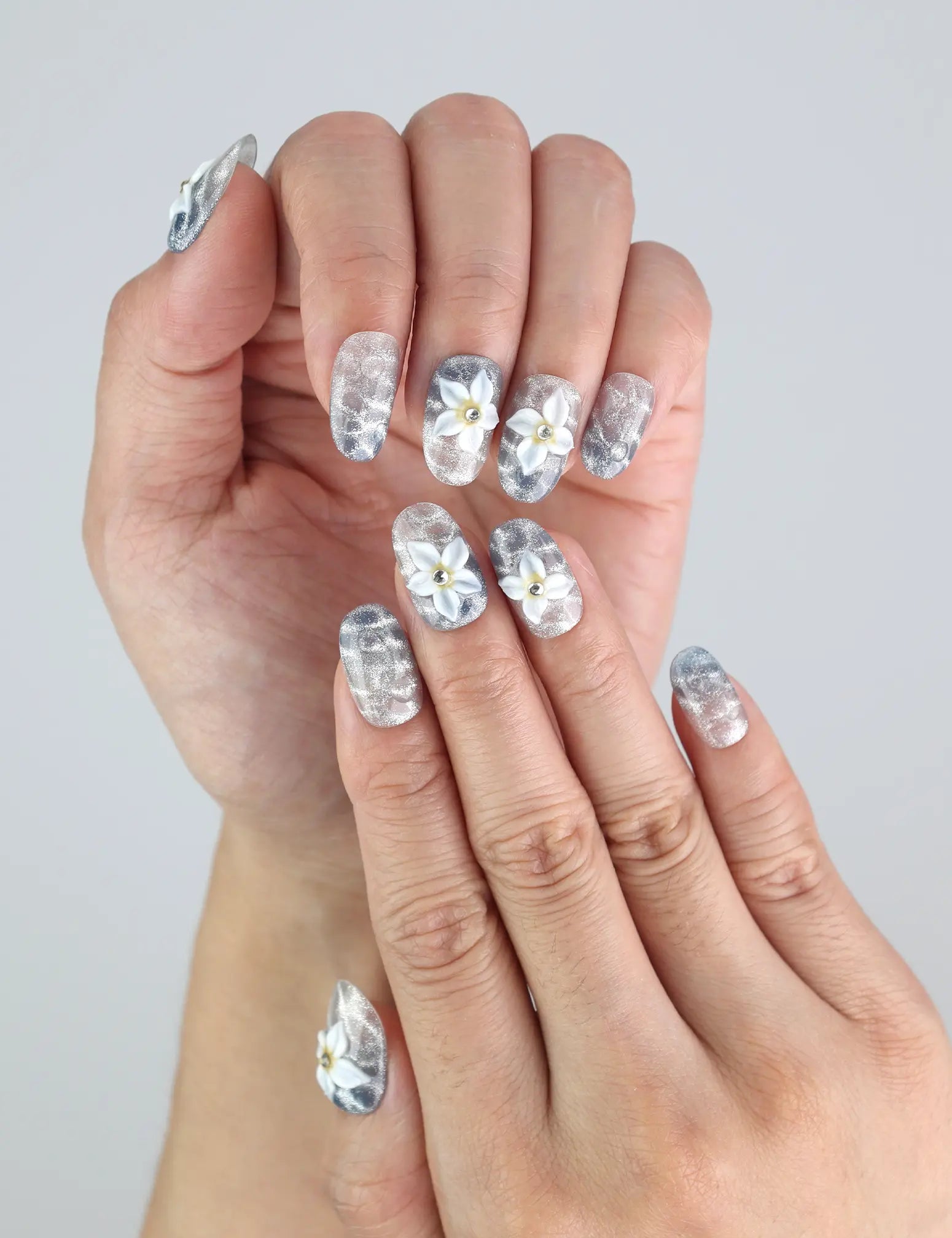 Close-up of Blue Blossom Singapore press on nails by Naillover—beachy blue tones and delicate flower details in trendy nail design.