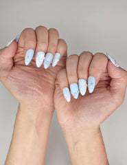 Naillover Blue Floral Diamond trendy nails styled on hands, highlighting coquette nails elegance and sky-blue matte finish