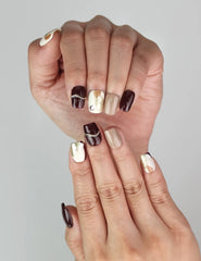 Close-up of Naillover Burgundy Wave trendy handmade press on nails with elegant gold detailing.