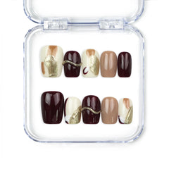 Naillover Burgundy Wave handmade Singapore press on nails in burgundy, white, and nude with elegant gold accents, trendy nail design.