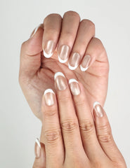 Close-up of Champagne Singapore press on nails on hand, delicate nude shimmer design, elegant classic nails by Naillover.