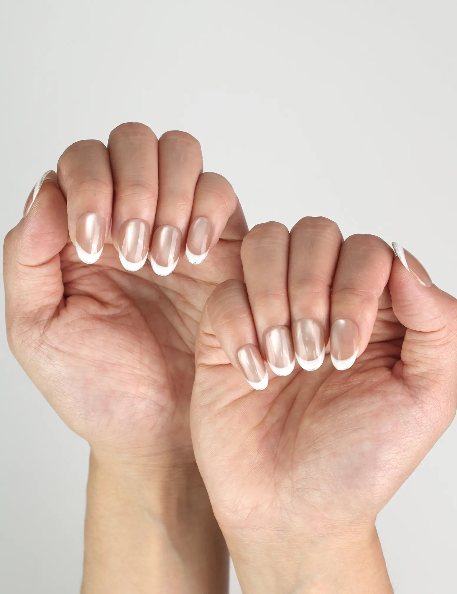 Naillover Champagne press on nails Singapore shown on fingers, handmade shimmering nude champagne style for timeless elegance.