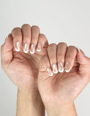 Naillover Champagne press on nails Singapore shown on fingers, handmade shimmering nude champagne style for timeless elegance.