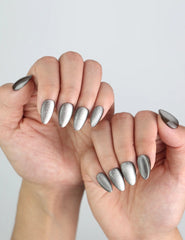 Natural lighting view of Naillover Chestnut Tone nails, highlighting rich silver cat eye finish.