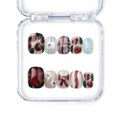 Naillover handmade press on nails with chocolate plaid base, 3D burgundy and white flowers, and ribbon details, perfect coquette nails from Singapore.