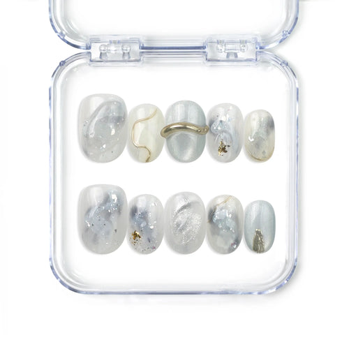 Naillover handmade press on nails with marble white and grey finish and gold accents from the Singapore press on nails collection.