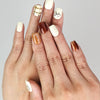 Model wearing Naillover Cocoa Grid handmade press on nails, showcasing creamy white and brown minimalist nail design.