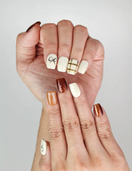 Close-up of Naillover Cocoa Grid press on nails, featuring bow accents and geometric lines for a classic yet trendy look.