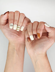 Elegant hand pose with Naillover Cocoa Grid simple nails, highlighting the creamy white and brown color palette.