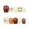Naillover Cocoa Grid simple nails set displayed on a clean white background, featuring bows and geometric nail art.