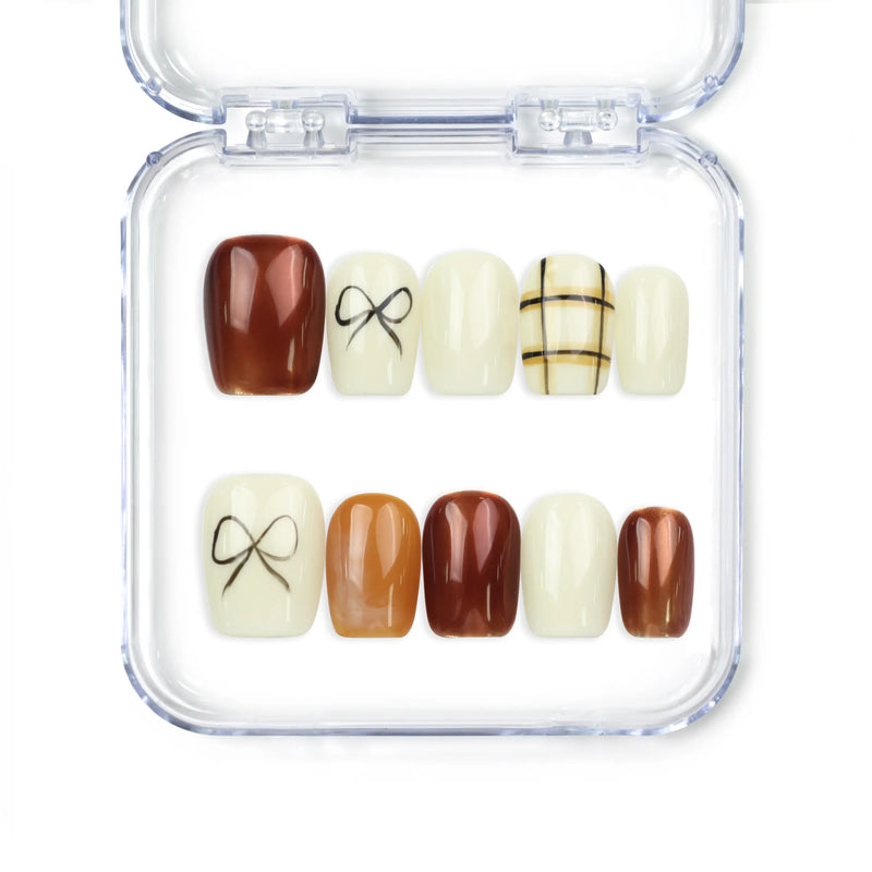 Cocoa Grid handmade press on nails by Naillover in creamy white and brown tones with bow and geometric design, classic and trendy nails style.
