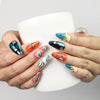 Cosmo Glam Singapore press on nails by Naillover in colorful Y2K style, shown holding a coffee cup
