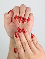 Close-up of Crimson Magnet handmade red nails, showcasing deep red shimmer and magnetic shine.