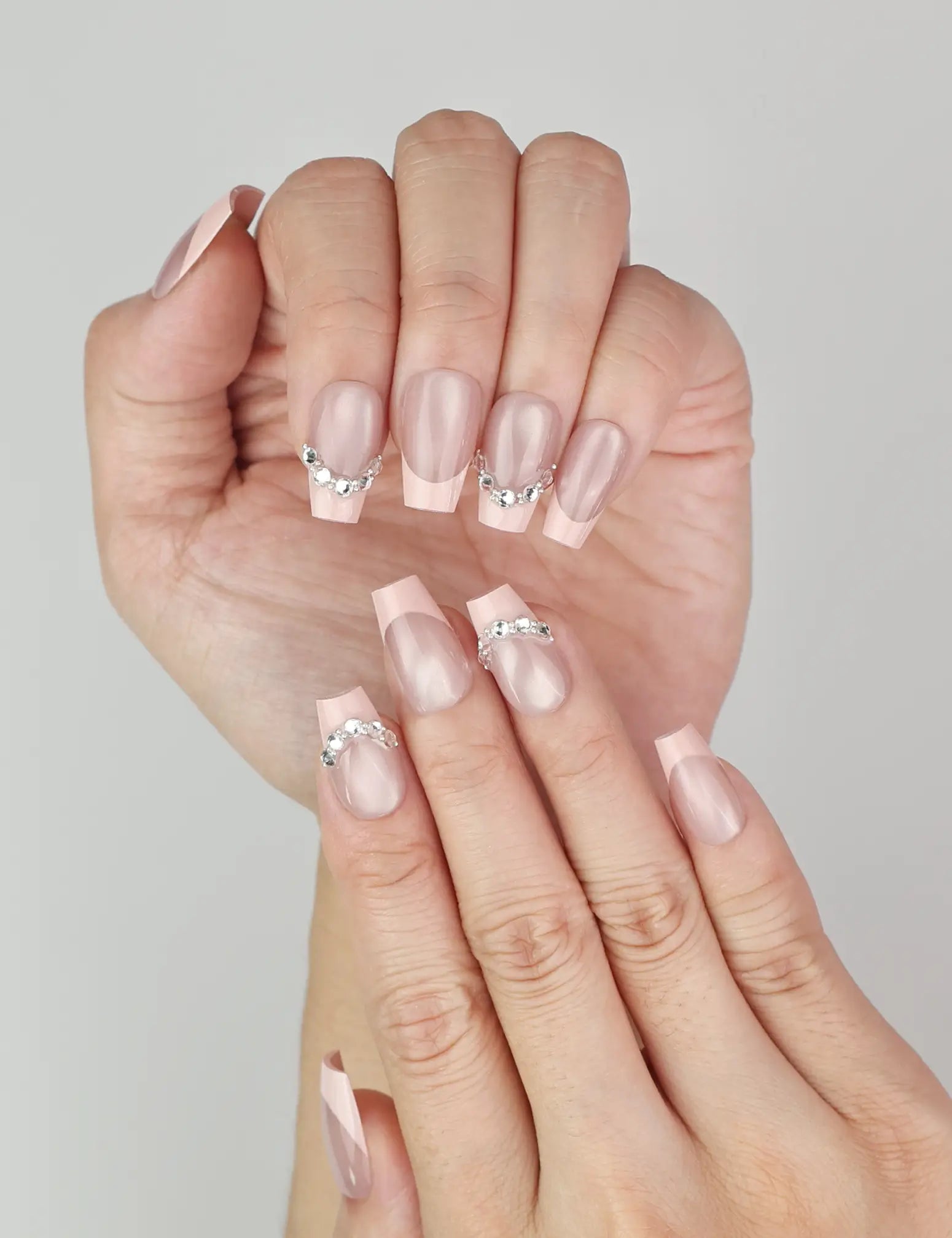 Close-up of Naillover handmade Crystal Crescent classic nails showing elegant crystal detail