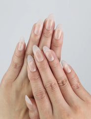 Model wears Crystal Whisper nails — Naillover handmade nude press on nails with subtle pearl accents, Singapore press on nails style.