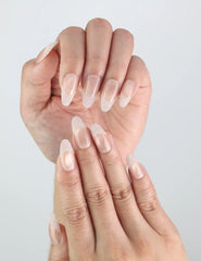 Close-up view of Crystal Whisper — delicate nude gradient nails with mini crystals and pearls by Naillover.