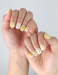 Hand pose highlighting the simple daisy accents and natural matte shine of Daisy Glow handmade press on nails.