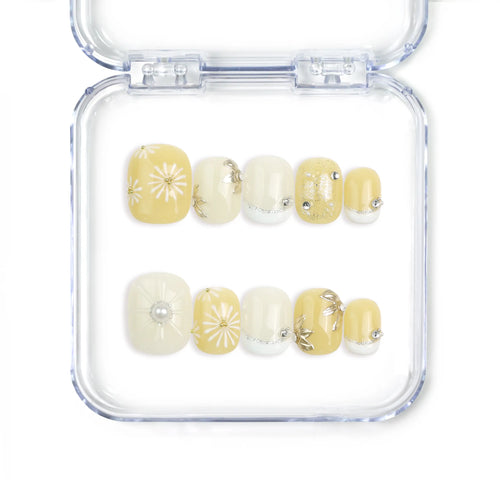 Flat lay of Naillover Daisy Glow Singapore press on nails with soft pastel base and minimalist daisy accents, handmade for a fresh, natural finish.