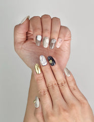 Close-up of Naillover Eclipse Core Singapore press on nails showing shimmering glitter and metallic finishes.